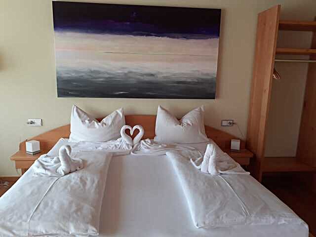 Bed in hotel room Heller Berg